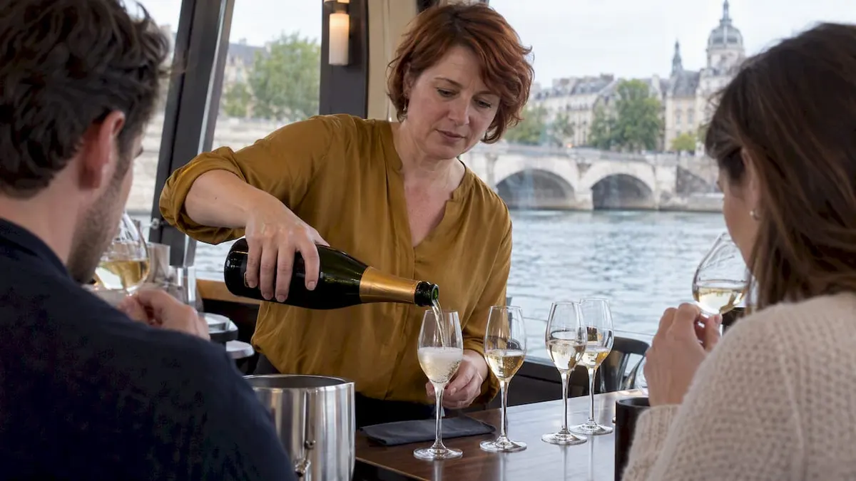 Sommelier pouring champagne tasting samples aboard